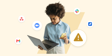 A hybrid worker looking frustrated while juggling a laptop and phone, surrounded by disconnected app icons including Slack, Zoom, and Gmail — illustrating the tool sprawl behind information silos.